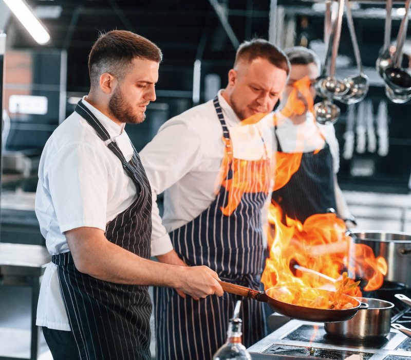 flaming-the-meal-on-frying-pan-kitchen-workers-is-together-preparing-the-food.jpg flaming-the-meal-on-frying-pan-kitchen-workers-is-together-preparing-the-food.jpg